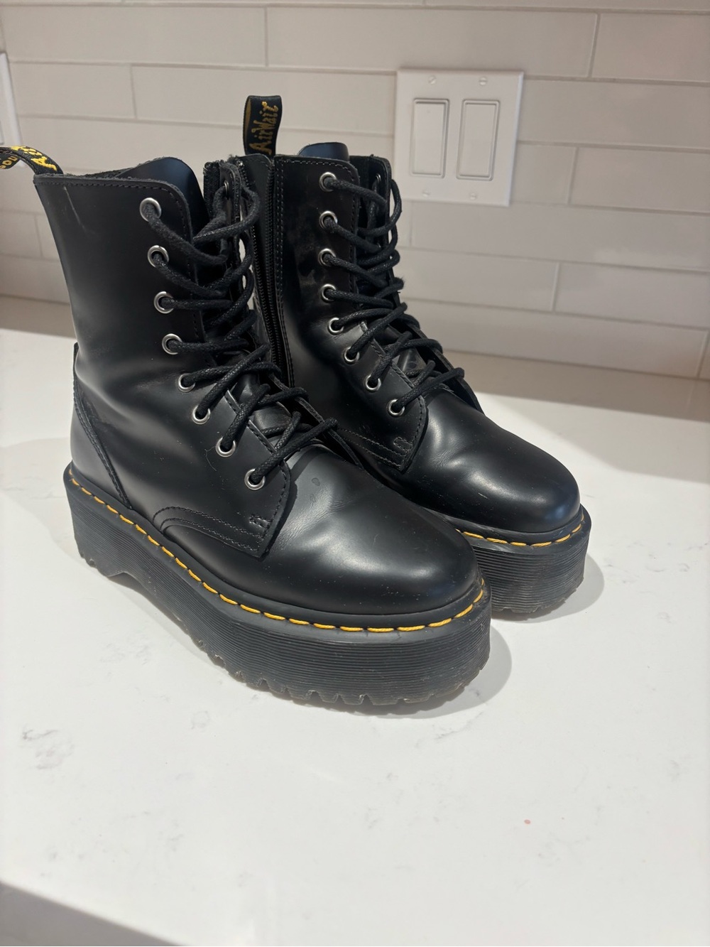Dr. Martens Black Leather Platform Lace-Up Boots with Yellow Welt Stitching